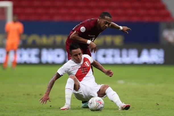 Christian Cueva of Peru and Jose Martinez of Venezuela fight for the ball during a Group B Match between Venezuela and Peru as part of Copa America...