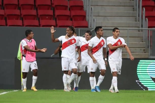 André Carrillo of Peru celebrates with teammates after scoring the opening goal during a Group B Match between Venezuela and Peru as part of Copa...
