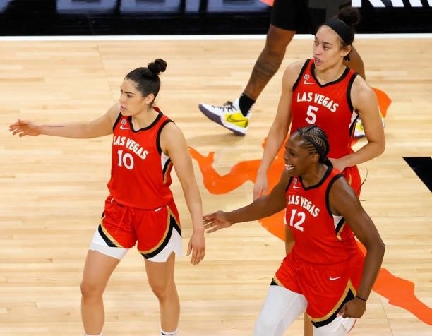 Kelsey Plum, Chelsea Gray and Dearica Hamby of the Las Vegas Aces react as time expires in overtime of their game against the Seattle Storm at...