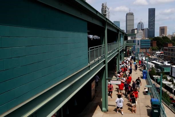 Fans walk through Fenway Park during the game between the Boston Red Sox and the New York Yankees on June 27, 2021 in Boston, Massachusetts.