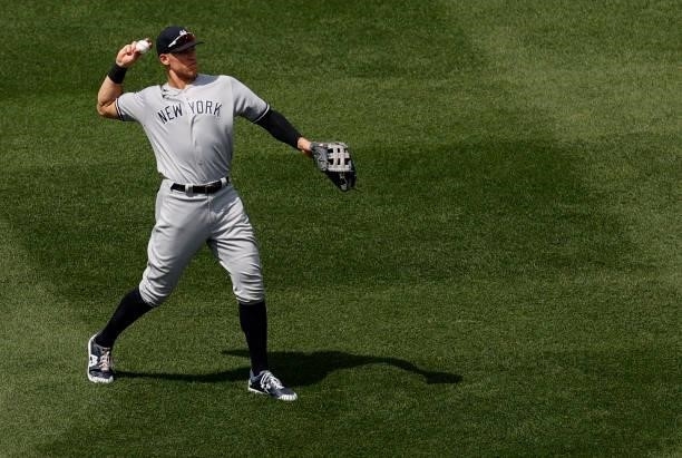 Aaron Judge of the New York Yankees throws to a teammate between innings during the game against the Boston Red Sox at Fenway Park on June 27, 2021...