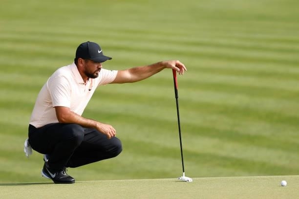 Jason Day of Australia looks over a putt on the 15th green during the final round of the Travelers Championship at TPC River Highlands on June 27,...