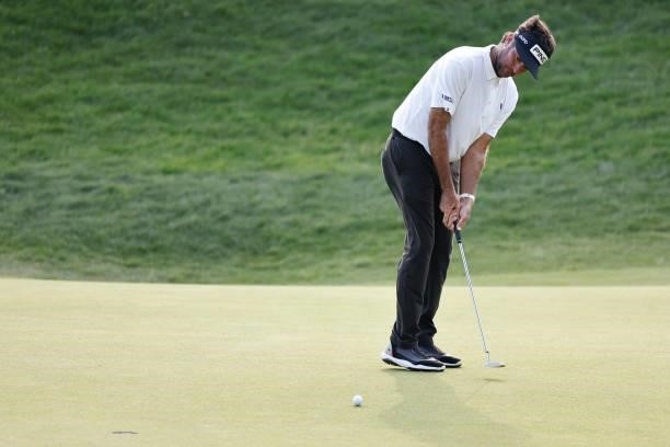Bubba Watson of the United States putts on the 18th green during the final round of the Travelers Championship at TPC River Highlands on June 27,...