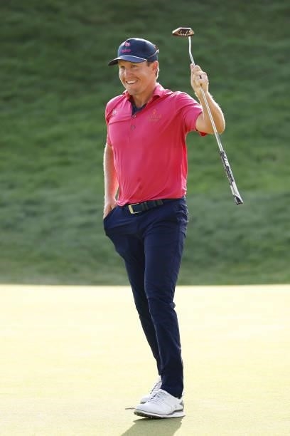 Kramer Hickok of the United States reacts to his birdie putt on the 18th green during the final round of the Travelers Championship at TPC River...