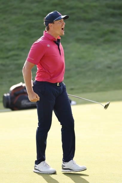 Kramer Hickok of the United States reacts to his birdie putt on the 18th green during the final round of the Travelers Championship at TPC River...
