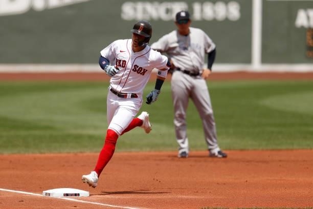 Enrique Hernandez of the Boston Red Sox rounds the bases after hitting a home run during the first inning against the New York Yankees at Fenway Park...