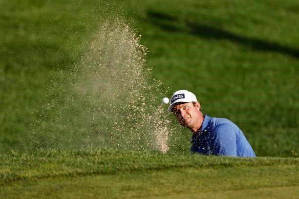 Harris English of the United States plays a shot from a bunker on the 18th hole during the second playoff hole against Kramer Hickok of the United...