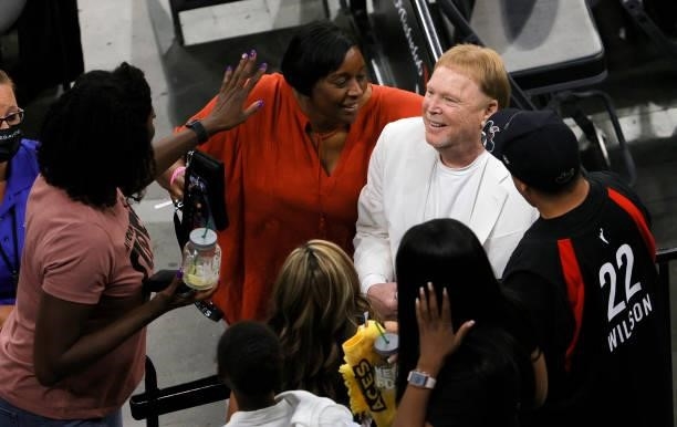 Las Vegas Raiders owner and managing general partner and Las Vegas Aces owner Mark Davis poses with fans after the Aces' 95-92 overtime victory over...