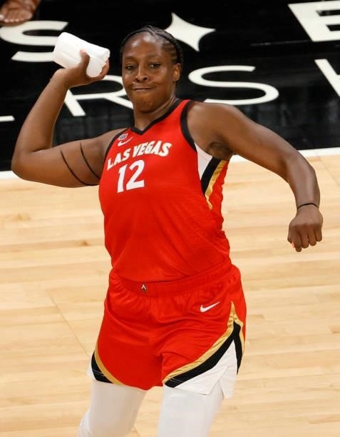 Chelsea Gray of the Las Vegas Aces of the Las Vegas Aces throws a T-shirt to fans after the team's 95-92 overtime victory over the Seattle Storm at...