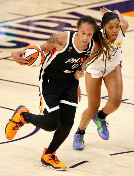 Brittney Griner of the Phoenix Mercury handles the ball ahead of Kristine Anigwe of the Los Angeles Sparks during the second half of the WNBA game at...
