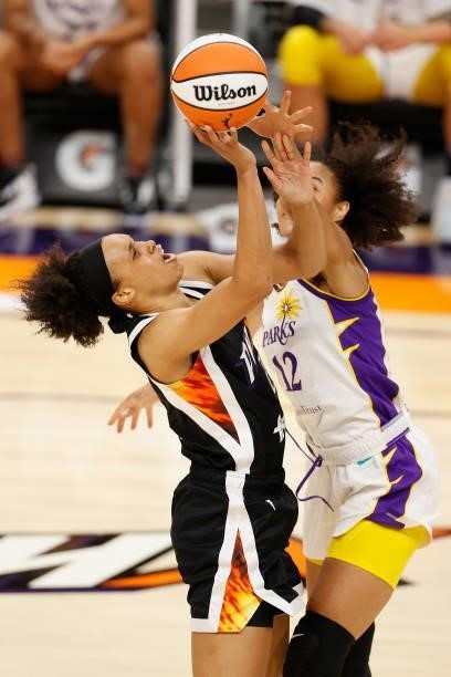 Megan Walker of the Phoenix Mercury attempts a shot against Nia Coffey of the Los Angeles Sparks during the second half of the WNBA game at Phoenix...