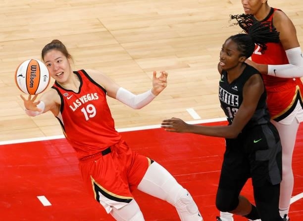 JiSu Park of the Las Vegas Aces tries to grab a rebound against Ezi Magbegor of the Seattle Storm during their game at Michelob ULTRA Arena on June...