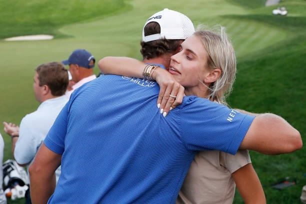 Harris English of the United States hugs his wife, Helen Marie Bowers, after winning the Travelers Championship in the eighth playoff hole over...