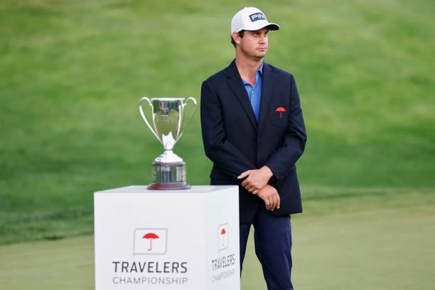 Harris English of the United States smiles during the trophy presentation after winning the Travelers Championship on the eighth playoff hole against...