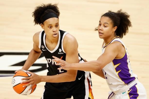 Megan Walker of the Phoenix Mercury looks to pass against Nia Coffey of the Los Angeles Sparks during the second half of the WNBA game at Phoenix...