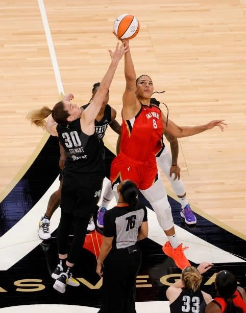 Liz Cambage of the Las Vegas Aces wins the tipoff against Breanna Stewart of the Seattle Storm during their game at Michelob ULTRA Arena on June 27,...
