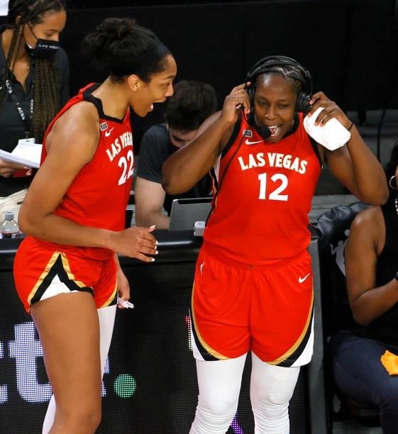 Ja Wilson of the Las Vegas Aces jokes with teammate Chelsea Gray as she is interviewed after the team's 95-92 overtime victory over the Seattle Storm...