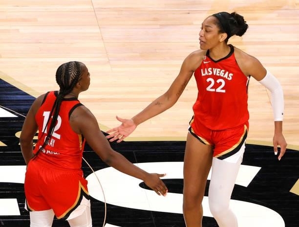 Chelsea Gray of the Las Vegas Aces is congratulated by teammate A'ja Wilson after Gray hit a pull-up jumper against the Seattle Storm with just over...