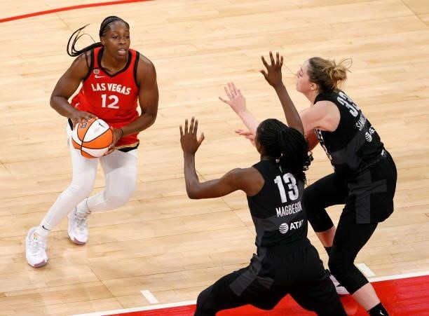 Chelsea Gray of the Las Vegas Aces is guarded by Ezi Magbegor and Katie Lou Samuelson of the Seattle Storm during their game at Michelob ULTRA Arena...