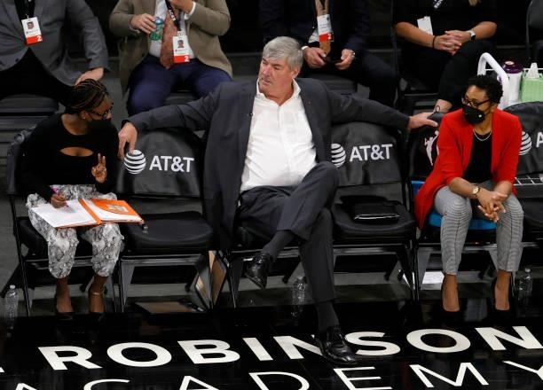 Assistant coach Tanisha Wright, head coach Bill Laimbeer and assistant coach Sugar Rodgers of the Las Vegas Aces talk on the bench during a game...