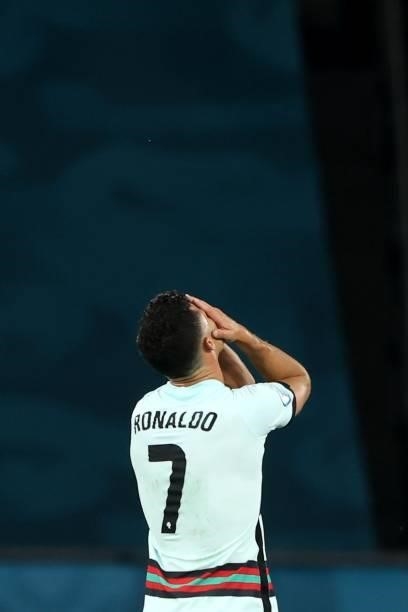 Cristiano Ronaldo of Portugal looks dejected following defeat in the UEFA Euro 2020 Championship Round of 16 match between Belgium and Portugal at...