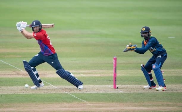 Dawid Malan of England hits runs as Niroshan Dickwella of Sri Lanka keeps wicket during the T20 International Series Third T20I match between England...