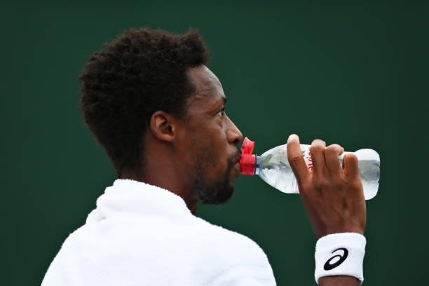 Gael Monfils of France takes a drink in his Men's Singles First Round match against Christopher O'Connell of Australia during Day One of The...