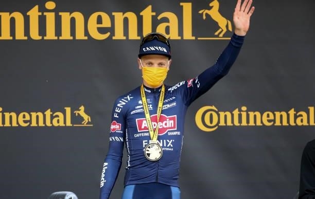 Tim Merlier of Belgium and Alpecin - Fenix celebrates on the podium ceremony winning stage 3 of the 108th Tour de France 2021, Stage 3 of 183 km from...