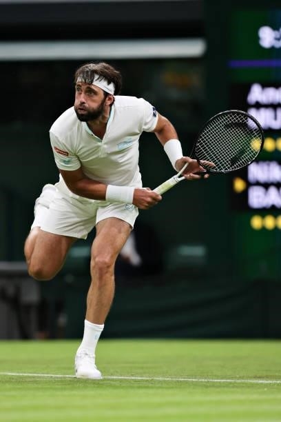 Nikoloz Basilashvili of Georgia serves in his Men's Singles First Round match against Andy Murray of Great Britain during Day One of The...