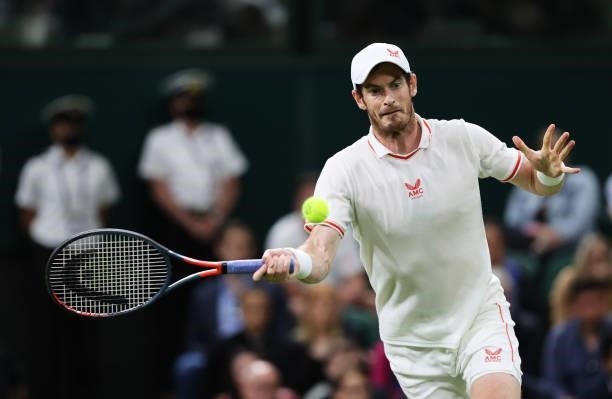 Andy Murray of Great Britain plays a forehand in his Men's Singles First Round match against Nikoloz Basilashvili of Georgia during Day One of The...