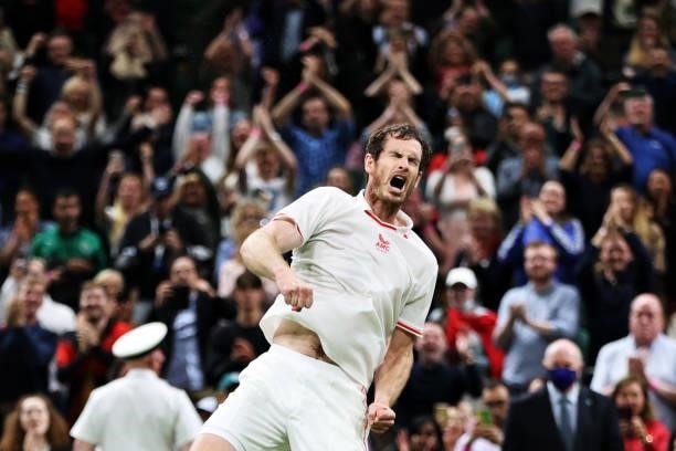 Andy Murray of Great Britain celebrates victory after winning his Men's Singles First Round match against Nikoloz Basilashvili of Georgia during Day...