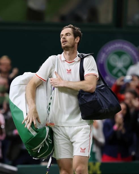 Andy Murray of Great Britain reacts as he walks off the court after winning his Men's Singles First Round match against Nikoloz Basilashvili of...