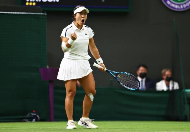 Kristie Ahn of The United States celebrates in her Ladies' Singles First Round match against Heather Watson of Great Britain during Day One of The...