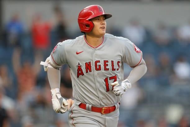 Shohei Ohtani of the Los Angeles Angels reacts after hitting a solo home run during the first inning against the New York Yankees at Yankee Stadium...