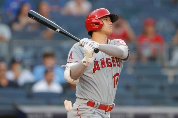 Shohei Ohtani of the Los Angeles Angels follows through after hitting a solo home run during the first inning against the New York Yankees at Yankee...