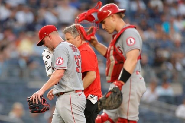 Dylan Bundy of the Los Angeles Angels leaves the game after falling ill during the second inning against the New York Yankees at Yankee Stadium on...