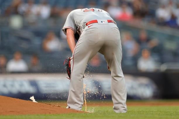 Dylan Bundy of the Los Angeles Angels falls ill while pitching during the second inning against the New York Yankees at Yankee Stadium on June 28,...