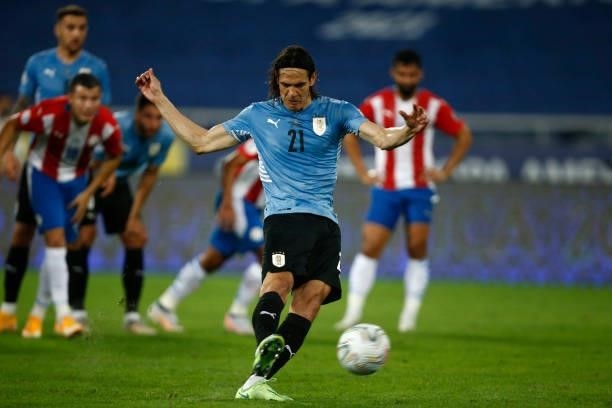 Edinson Cavani of Uruguay kicks a penalty to score the first goal of his team during a group A match between Uruguay and Paraguay as part of Conmebol...