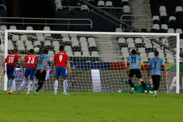 Edinson Cavani of Uruguay kicks a penalty to score the first goal of his team during a group A match between Uruguay and Paraguay as part of Conmebol...
