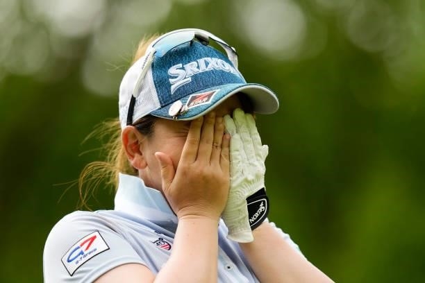 Yumiko Yoshida of Japan hides her face on the 2nd hole during the first round of the Sky Ladies ABC Cup at the ABC Golf Club on June 29, 2021 in...