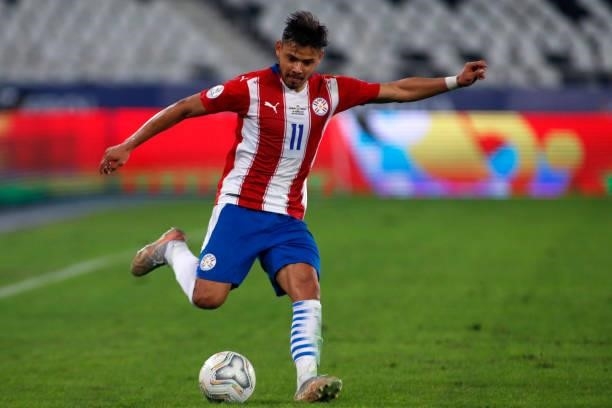 Angel Romero of Paraguay kicks the ball during a group A match between Uruguay and Paraguay as part of Conmebol Copa America Brazil 2021 at Estadio...