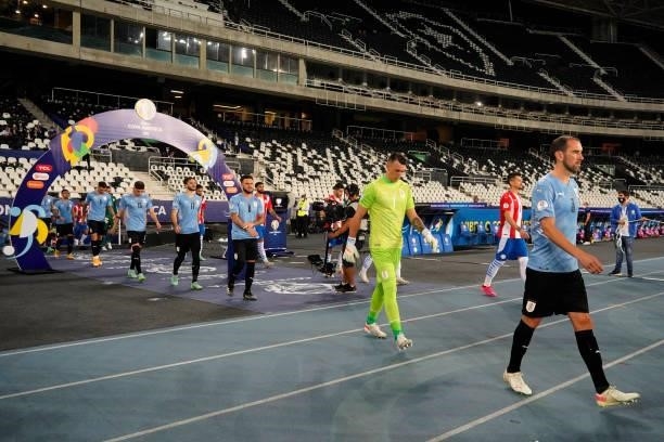 Players of Uruguay and Paraguay enter the pitch before a group A match between Uruguay and Paraguay as part of Conmebol Copa America Brazil 2021 at...