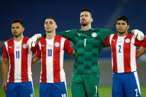 Angel Romero, Miguel Almiron, goalkeeper Antony Silva and Robert Rojas of Paraguay line up before a group A match between Uruguay and Paraguay as...