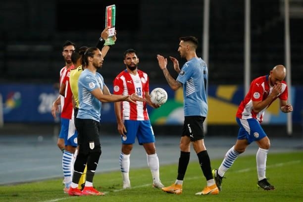 Martín Caceres of Uruguay replaces teammate Matias Vecino of Uruguay during a group A match between Uruguay and Paraguay as part of Conmebol Copa...