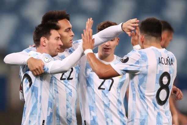 Lautaro Martinez of Argentina celebrates with teammates after scoring the fourth goal of his team during a Group A match between Argentina and...