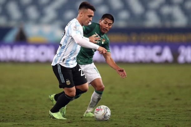 Lautaro Martinez of Argentina fights for the ball with Erwin Saavedra of Bolivia during a Group A match between Argentina and Bolivia as part of Copa...