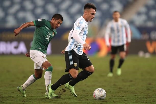 Lautaro Martinez of Argentina fights for the ball with Erwin Saavedra of Bolivia during a Group A match between Argentina and Bolivia as part of Copa...