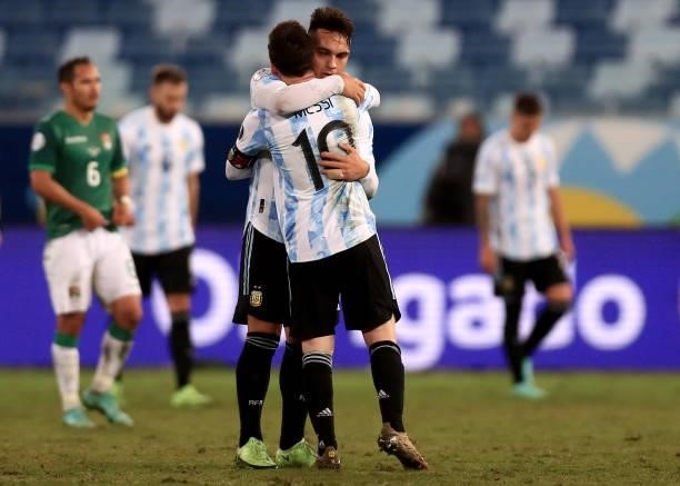 Lionel Messi of Argentina hugs teammate Lautaro Martinez after winning a Group A match between Argentina and Bolivia as part of Copa America 2021 at...