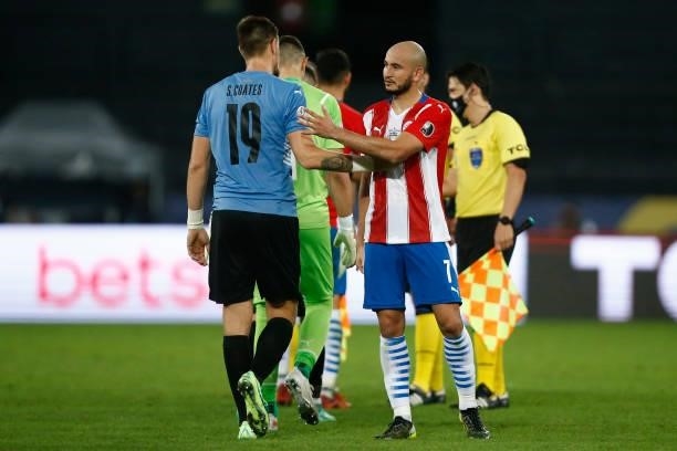 Sebastian Coates of Uruguay greets Carlos Gonzalez of Paraguay after a group A match between Uruguay and Paraguay as part of Conmebol Copa America...