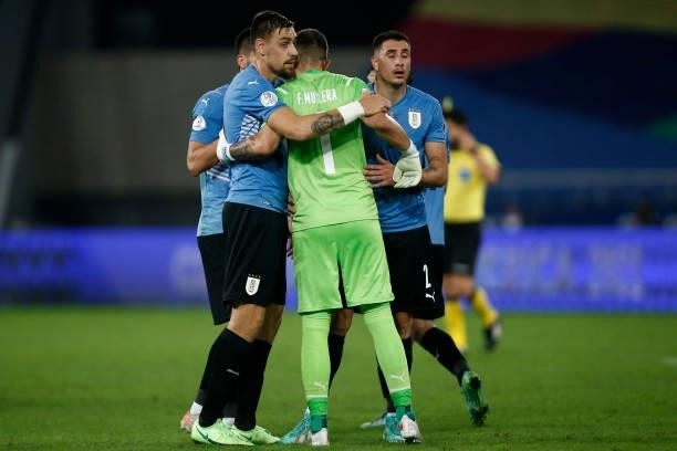 Fernando Muslera goalkeeper of Uruguay hugs teammates after winning a group A match between Uruguay and Paraguay as part of Conmebol Copa America...